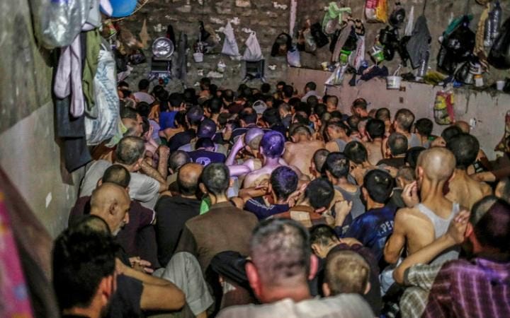 Suspected Islamic State members swept up by Iraqi forces in Mosul are held in a cramped and stifling prison Suspected Islamic State members swept up by Iraqi forces in Mosul are held in a cramped and stifling prison