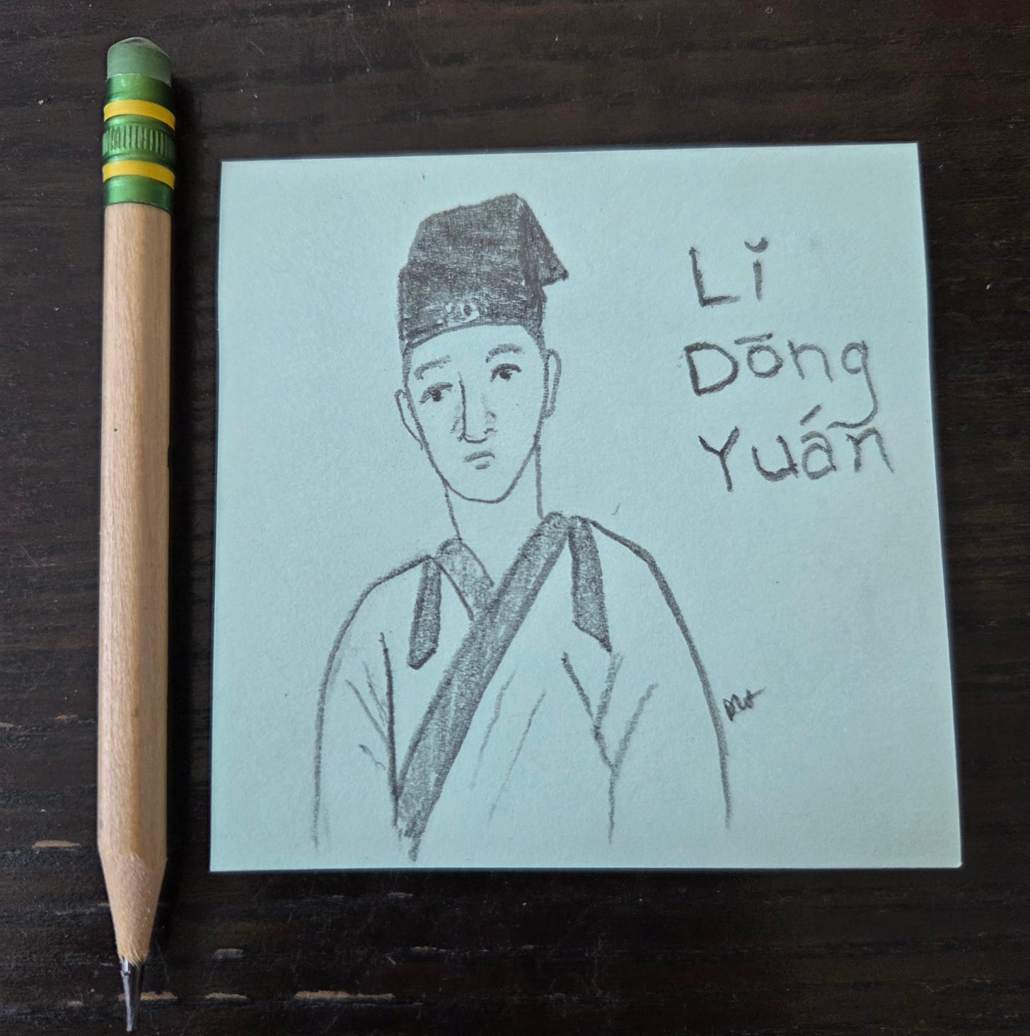 Photo of a sketch of Li Dongyuan, an ancient Chinese physician, with a pencil next to the sketchpad