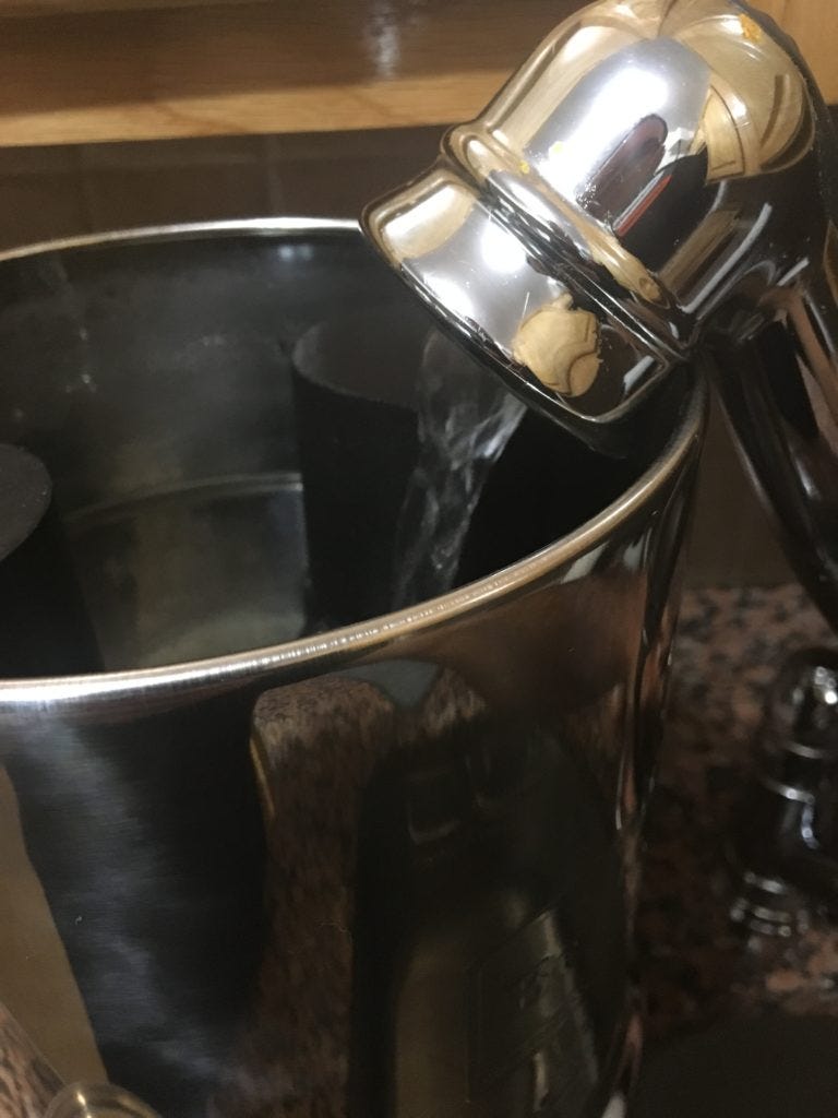 The Travel Berkey being filled.
