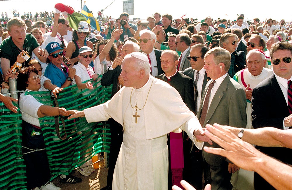 Pope John Paul II greets participants of World Youth Day as he arrives for Mass at Cherry Creek State Park in Aurora, Colorado, Aug. 15, 1993. (AP/Jeff Robbins, File) Pope John Paul II greets participants of World Youth Day as he arrives for Mass at Cherry Creek State Park in Aurora, Colorado, Aug. 15, 1993. (AP/Jeff Robbins, File)