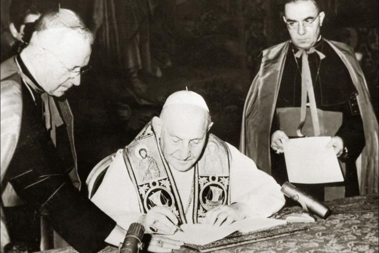 Pope John XXIII (C) signing he encyclical "Pacem in Terris", in his private library, on April 9, 1963 in Rome. On the left, Cardinal Amleto Giovanni Cicognani, state secretary of the Vatican. Pope John XXIII (C) signing he encyclical "Pacem in Terris", in his private library, on April 9, 1963 in Rome. On the left, Cardinal Amleto Giovanni Cicognani, state secretary of the Vatican.