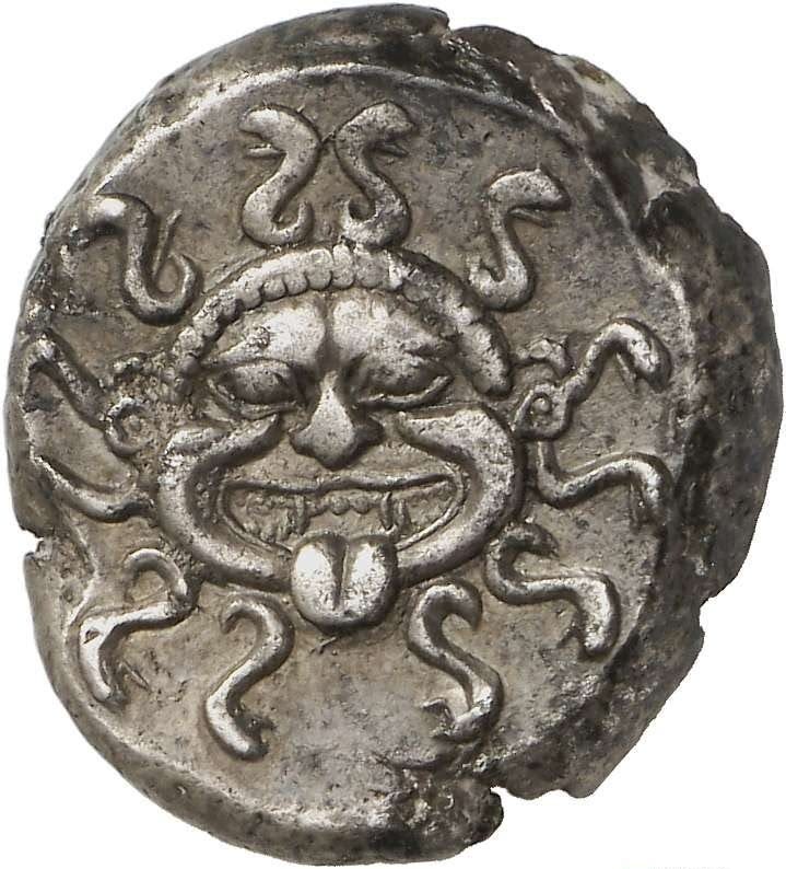 This may contain: an ancient coin with a face on it