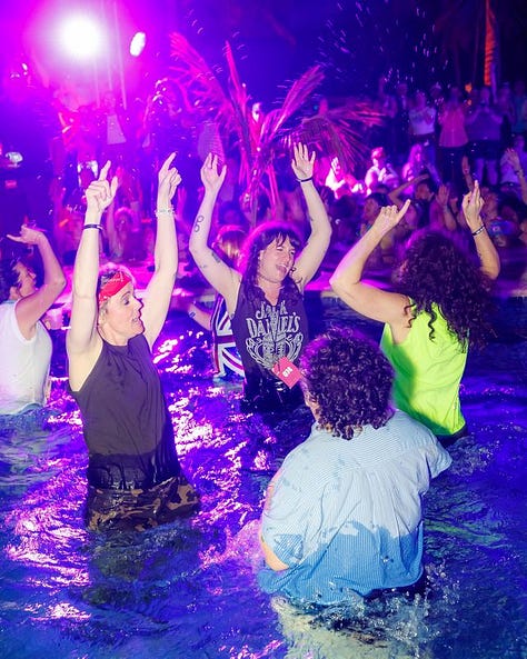 Megan Falley and Brandi Carlile spraying a pool of people with champagne, Megan Brandi and Catherine Carlile dancing in a pool fully-clothed with their hands in the air, Brandi holding Meg's hand as they are both about to fall backward into a trust fall
