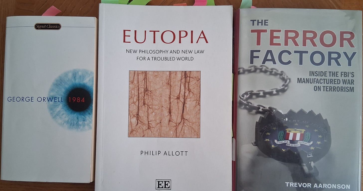 A group of books on a table

Description automatically generated