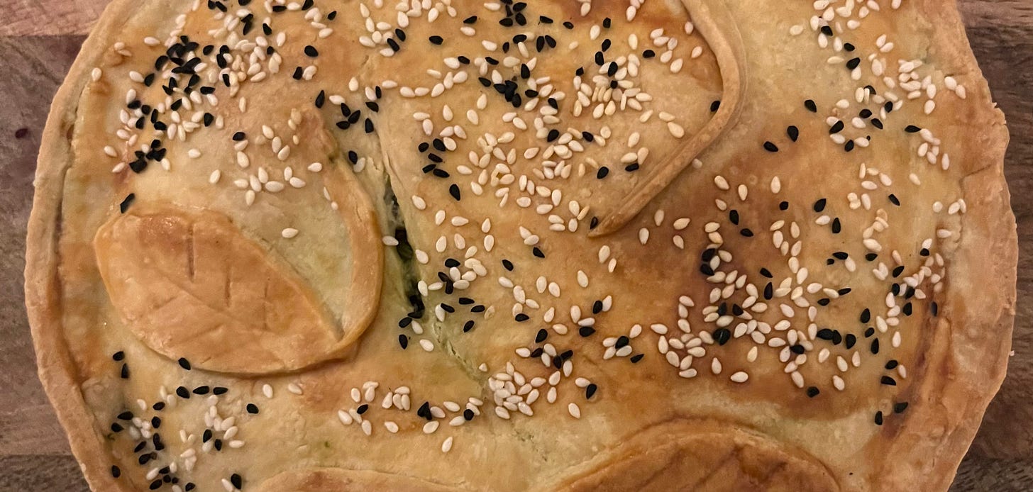 seen from above, a vegetable pie sprinkled with sesame and nigella seeds seen from above, a vegetable pie sprinkled with sesame and nigella seeds