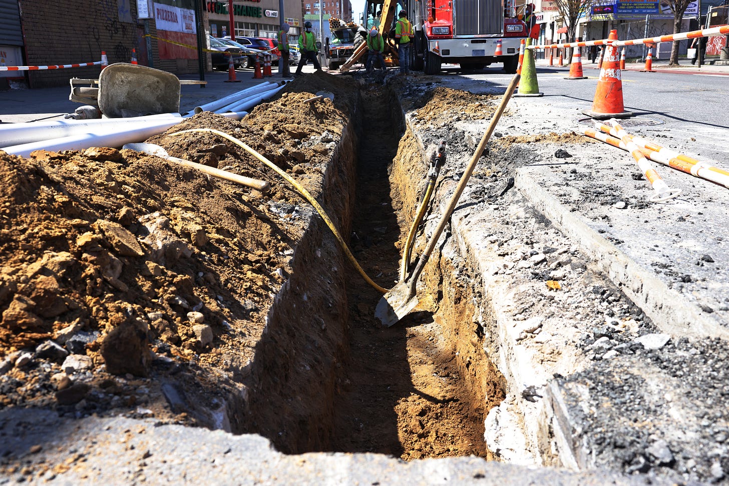 Construction worker make infrastructure repairs on the intersection of Church Avenue and Coney Island Avenue in the Flatbush neighborhood of Brooklyn borough on April 06, 2021 in New York City