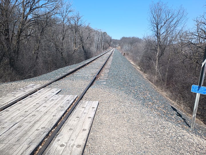 trail towards the train tracks, then standing on train tracks