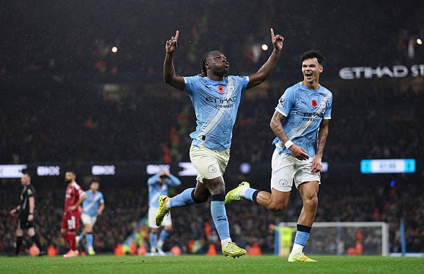 Jeremy Doku of Manchester City celebrates scoring his team's third goal during the Premier League match between Manchester City and Liverpool at... Jeremy Doku of Manchester City celebrates scoring his team's third goal during the Premier League match between Manchester City and Liverpool at...
