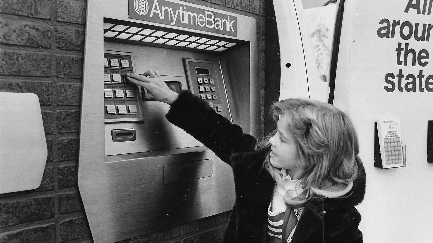 Christine Beers, 8, the daughter of Mr. and Mrs. Kenny Beers of North Akron, pushes buttons in 1977 on an Anytime Bank machine at BancOhio in Rolling Acres Mall. The former Akron National Bank introduced ATMs to the city in 1973.