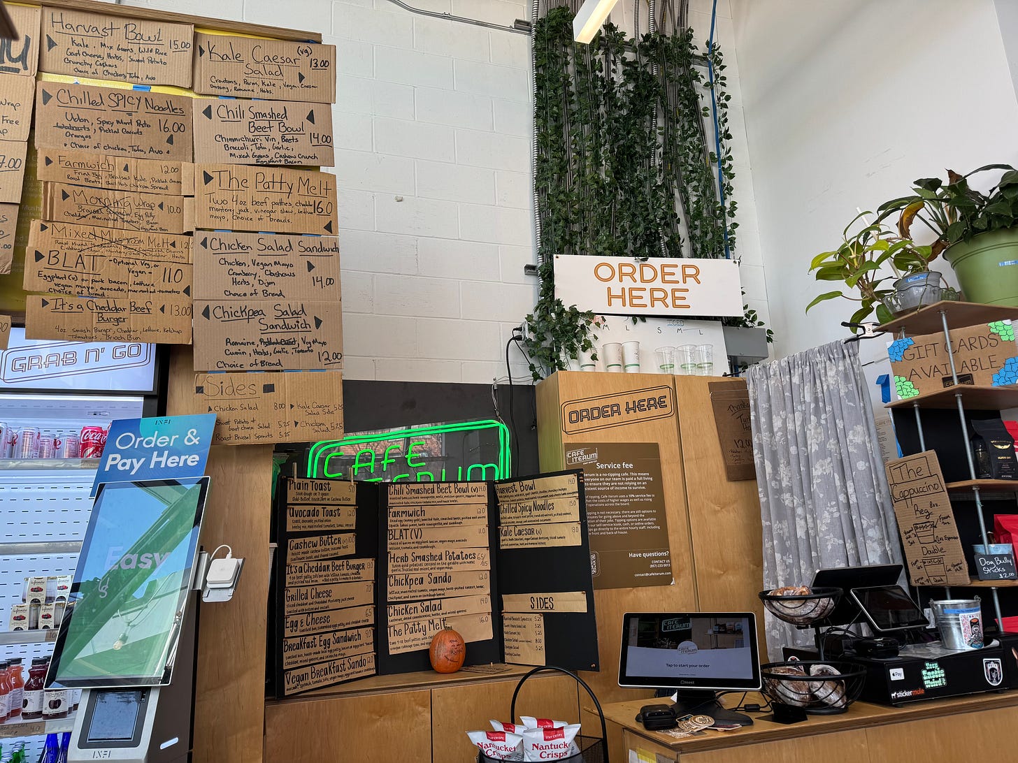 menu boards and ordering screens at Cafe Iterum in East Boston