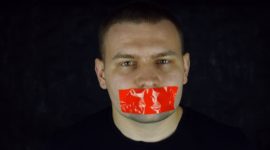 Man with tape over his mouth Man with tape over his mouth