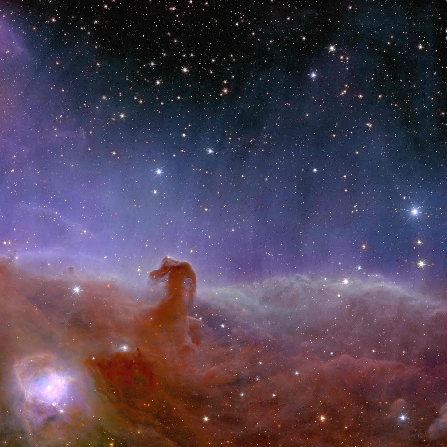 A detailed view of the Horsehead Nebula in Orion, where plumes of gas and starlight form a vivid cloud against deep space. The image suggests creation, connection, and the vast transparency of the universe.
