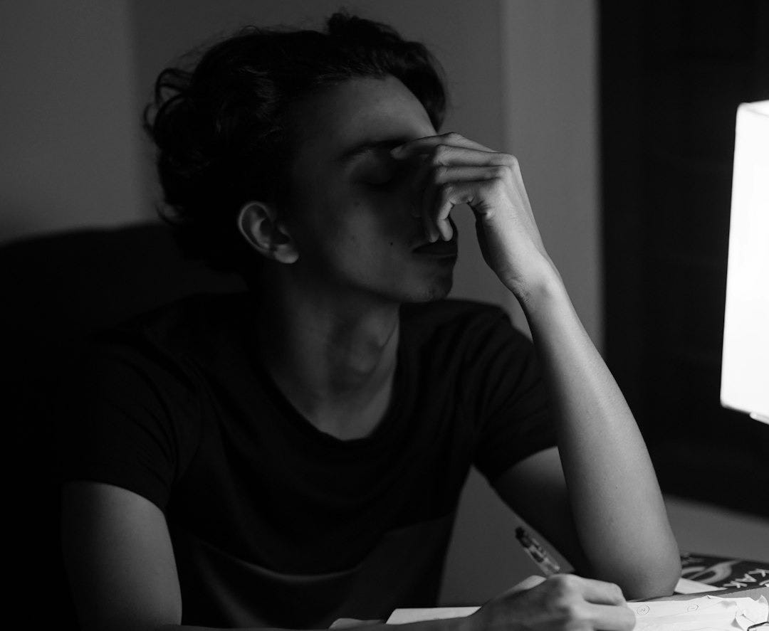 A woman sitting at a desk in front of a computer A woman sitting at a desk in front of a computer