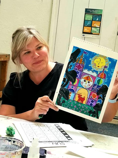 Happy painters holding up their Mary Blair-inspired paintings.