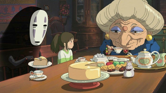 A still from Spirited Away in which No-Face, Chihiro, and Zeniba have tea.
