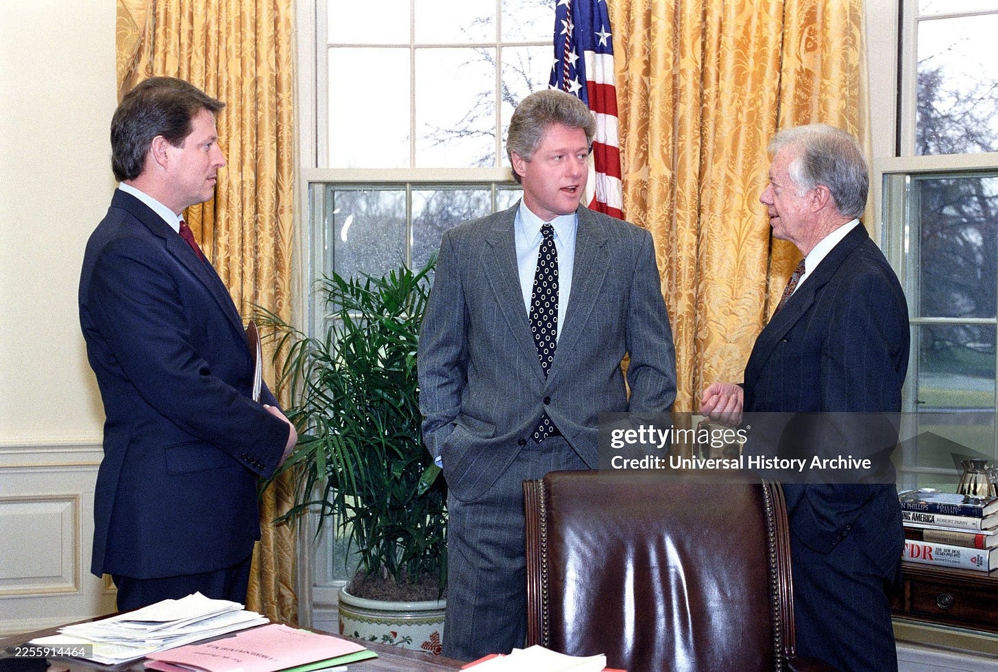U.S. President Bill Clinton and U.S. Vice President Al Gore meeting with former U.S. President Jimmy Carter in the oval office of the White House