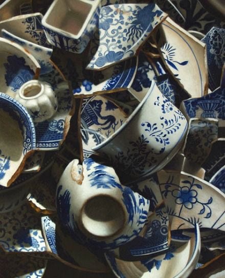 shattered pieces of blue and white pottery