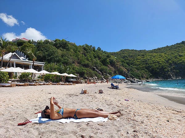 woman sunbathing on Shell Beach, Gustavia, St. Barth