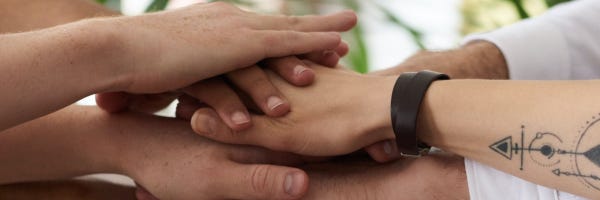 hands in the middle on top of each other