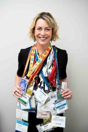 A person wearing lanyards and a black shirt

Description automatically generated