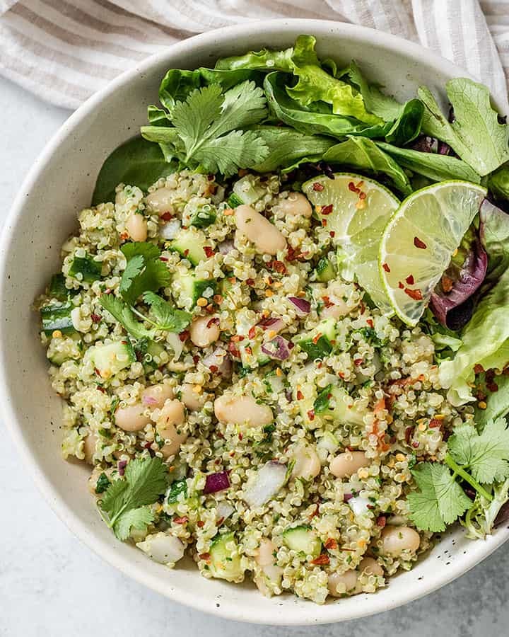 Close up of quinoa salad tossed with cilantro dressing.