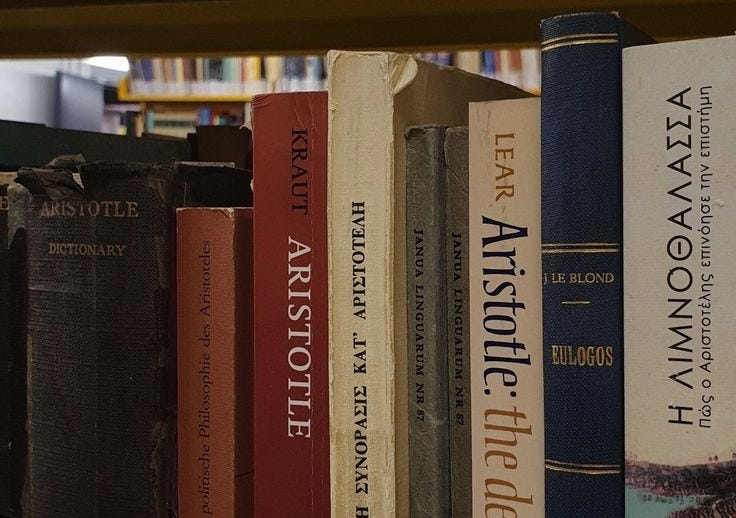 This may contain: a row of books sitting on top of a book shelf