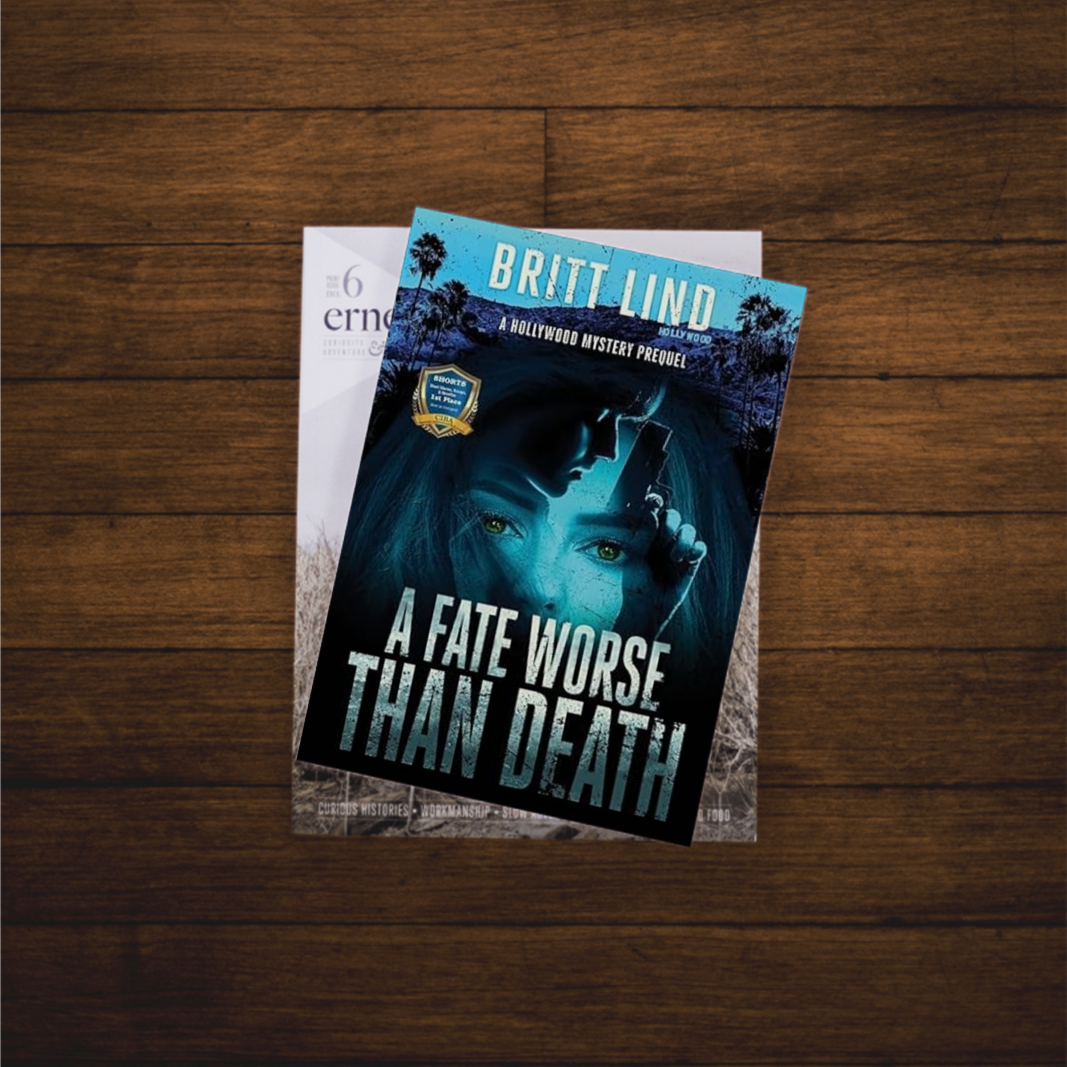 Book "A Fate Worse Than Death" by Britt Lind on another book on dark brown hardwood floors Book "A Fate Worse Than Death" by Britt Lind on another book on dark brown hardwood floors