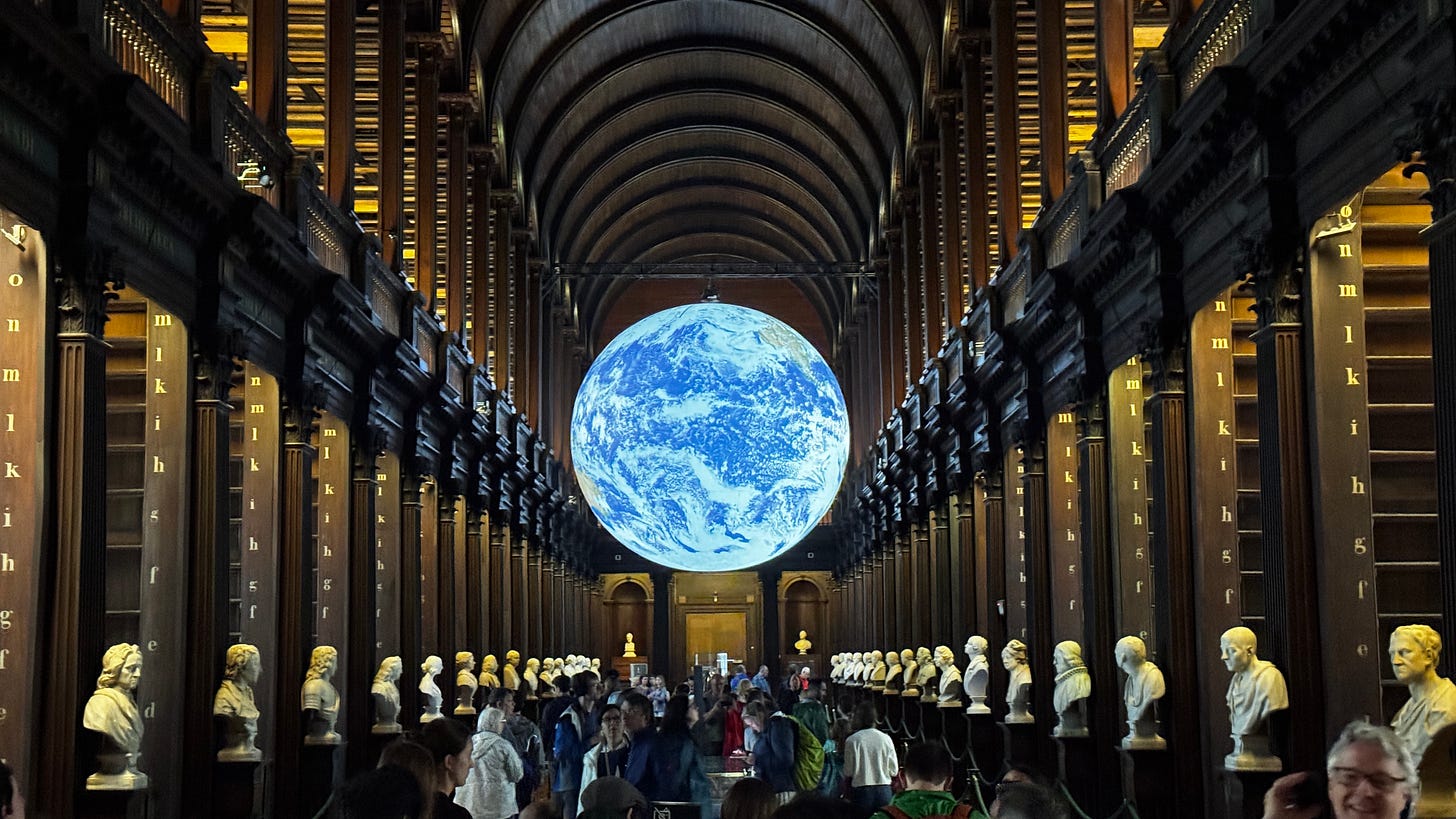 an illuminated globe hanging in the Long Library in Trinity College