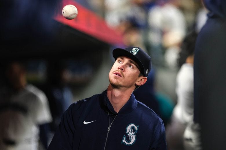 Emerson Hancock tosses a ball in the dugout as the Mariners play the Atlanta Braves, April 29, 2024, in Seattle. (Dean Rutz / The Seattle Times) Emerson Hancock tosses a ball in the dugout as the Mariners play the Atlanta Braves, April 29, 2024, in Seattle. (Dean Rutz / The Seattle Times)