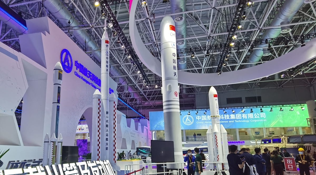 A model of the Long March 9 launch vehicle (center, grey and white) on display during China’s 2024 Space Day exhibition. 