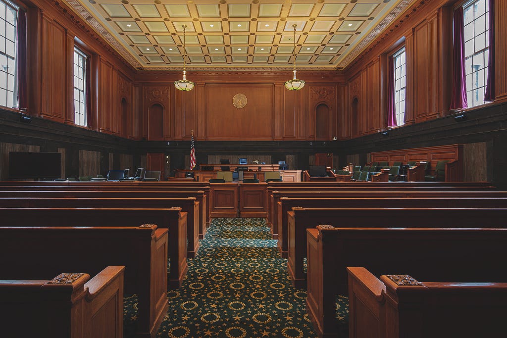 A photograph of the interior of a courtroom in the Thurgood Marshall U.S. Courthouse, in New York City, New York