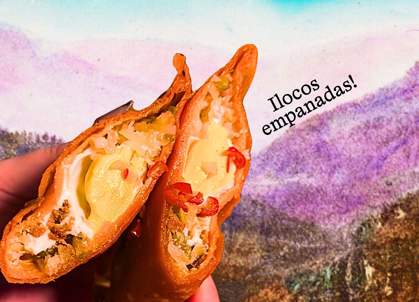 A hand holds up an empanada cut in half in front of a collage backdrop