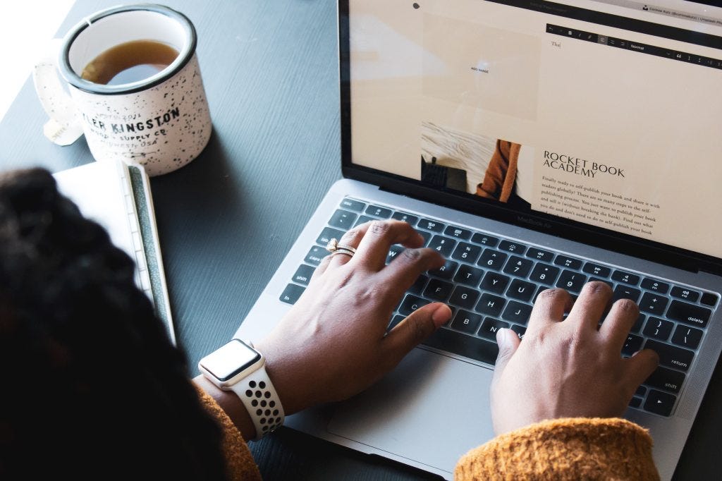A photo of someone using a laptop