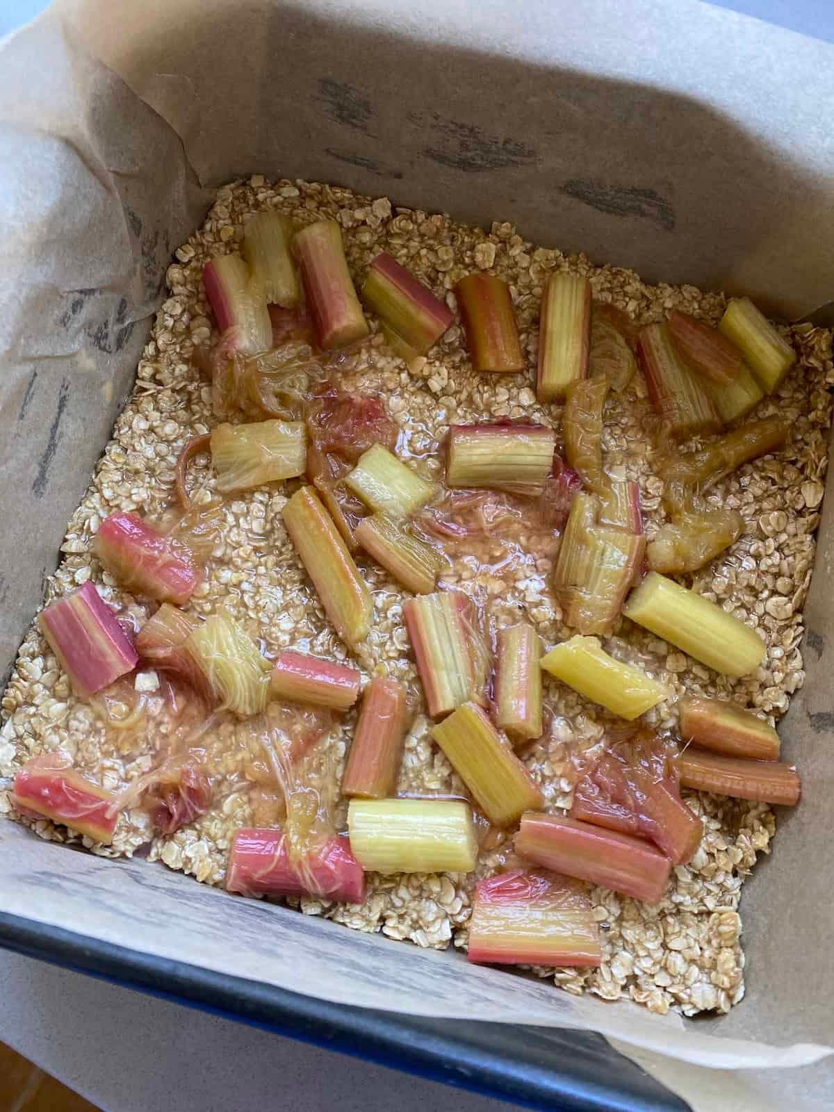 Rhubarb spread over a layer of Flapjack mixture. Rhubarb spread over a layer of Flapjack mixture.