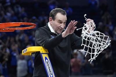 Coach K cutting the nets