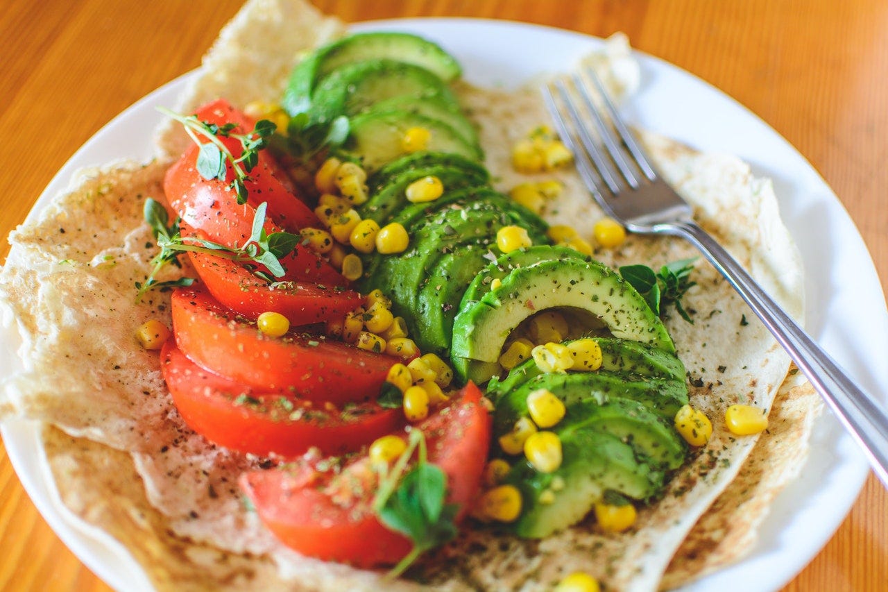 tortillas with avocado tomato and corn