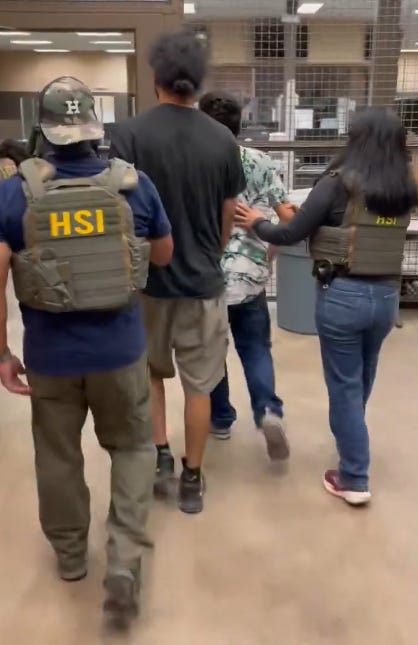 HSI Agents bring in illegal aliens for booking following the raid of a Mercedes, Texas stash house. (Homeland Security Investigations photo) HSI Agents bring in illegal aliens for booking following the raid of a Mercedes, Texas stash house. (Homeland Security Investigations photo)