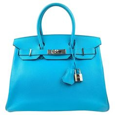 This contains an image of: HERMES Birkin 30 Blue Aztec Chèvre Leather Bag This contains an image of: HERMES Birkin 30 Blue Aztec Chèvre Leather Bag