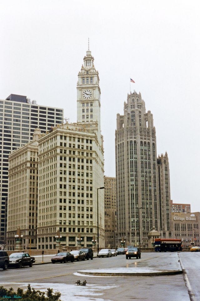 The iconic Wrigley Building and Tribune Tower anchoring the north bank of the Chicago River at Michigan Avenue, viewed from Wacker Drive, February 1996. The iconic Wrigley Building and Tribune Tower anchoring the north bank of the Chicago River at Michigan Avenue, viewed from Wacker Drive, February 1996.