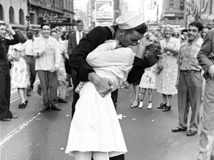 A sailor kissing a child in a city street

AI-generated content may be incorrect.