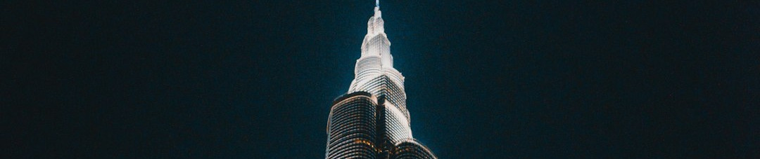 black and gray concrete building low angle photography