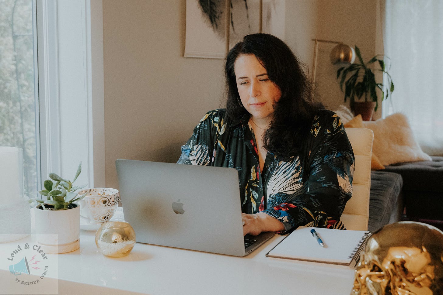 author at her desk writing