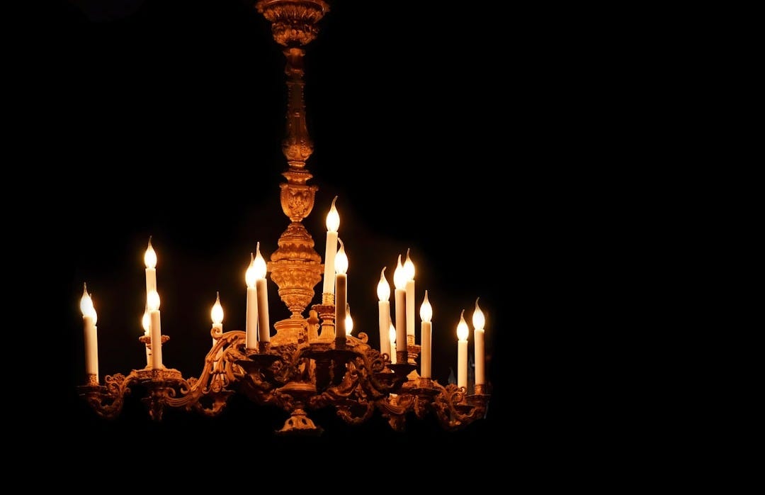 lighted candles on brown wooden stand lighted candles on brown wooden stand