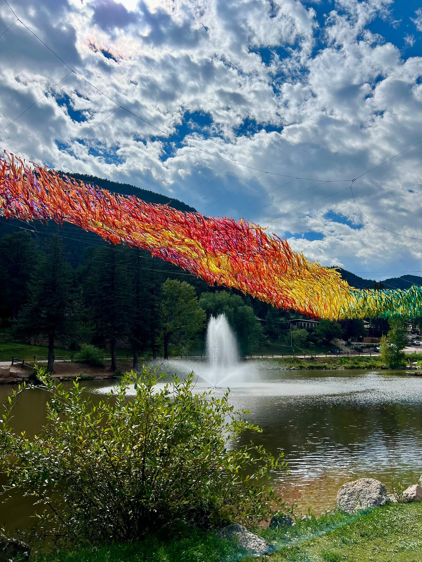A fountain in front of a lake

AI-generated content may be incorrect.
