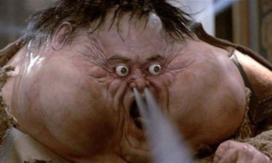 screenshot from John Carpenter's 'Big Trouble in Little China' in which weather god Thunder inflates himself to cartoonish proportions (face a meter wide, eyes bulging, steam blowing from nostrils) before exploding in a mess of green goo. screenshot from John Carpenter's 'Big Trouble in Little China' in which weather god Thunder inflates himself to cartoonish proportions (face a meter wide, eyes bulging, steam blowing from nostrils) before exploding in a mess of green goo.