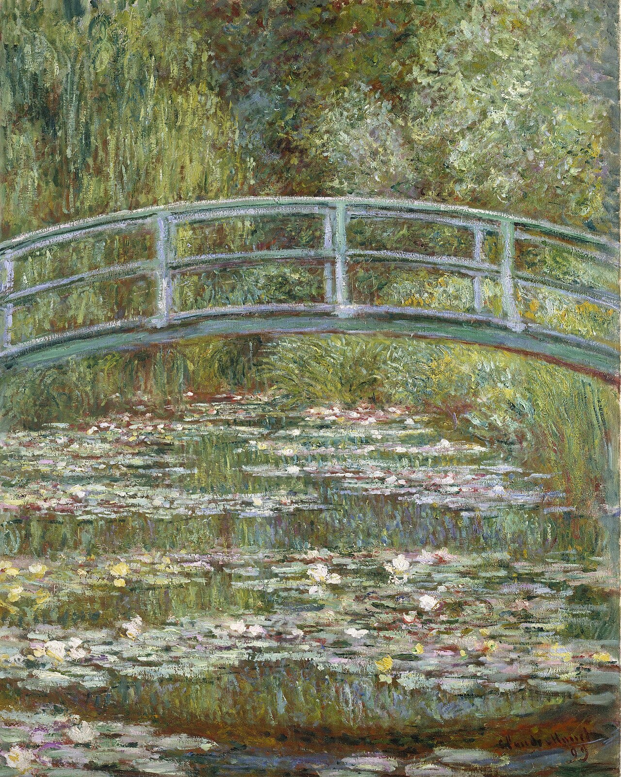 A green Japanese footbridge arches over a pond thick with water lilies and reflections A green Japanese footbridge arches over a pond thick with water lilies and reflections