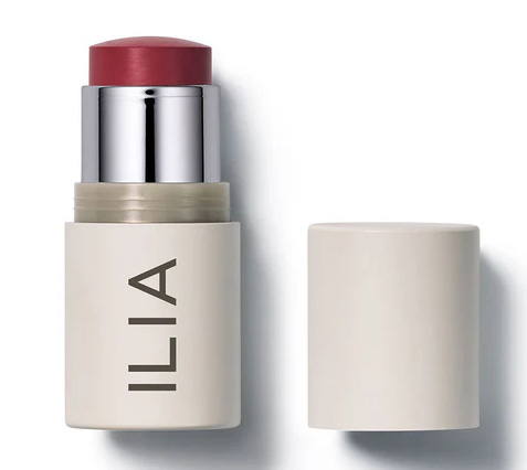 ILIA Beauty Multi-Stick in a creamy berry shade, shown open with its minimalist off-white packaging. A versatile, buildable cheek and lip color for an unfiltered, glowing finish.