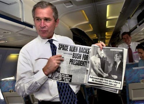 A person holding a newspaper

Description automatically generated