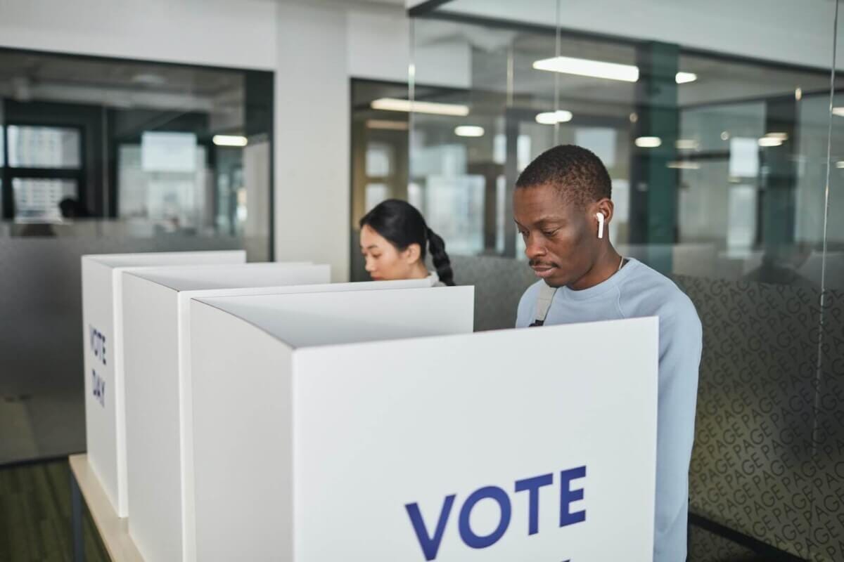Man in a voting booth Man in a voting booth