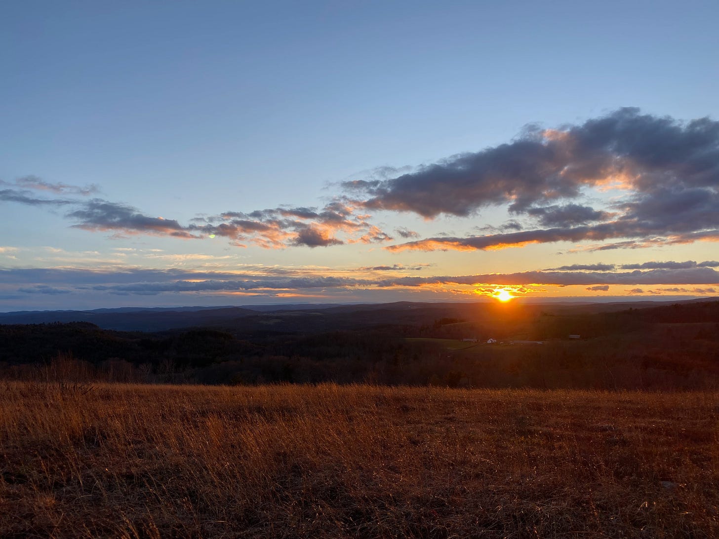 A December sunset on a ridge-top meadow.